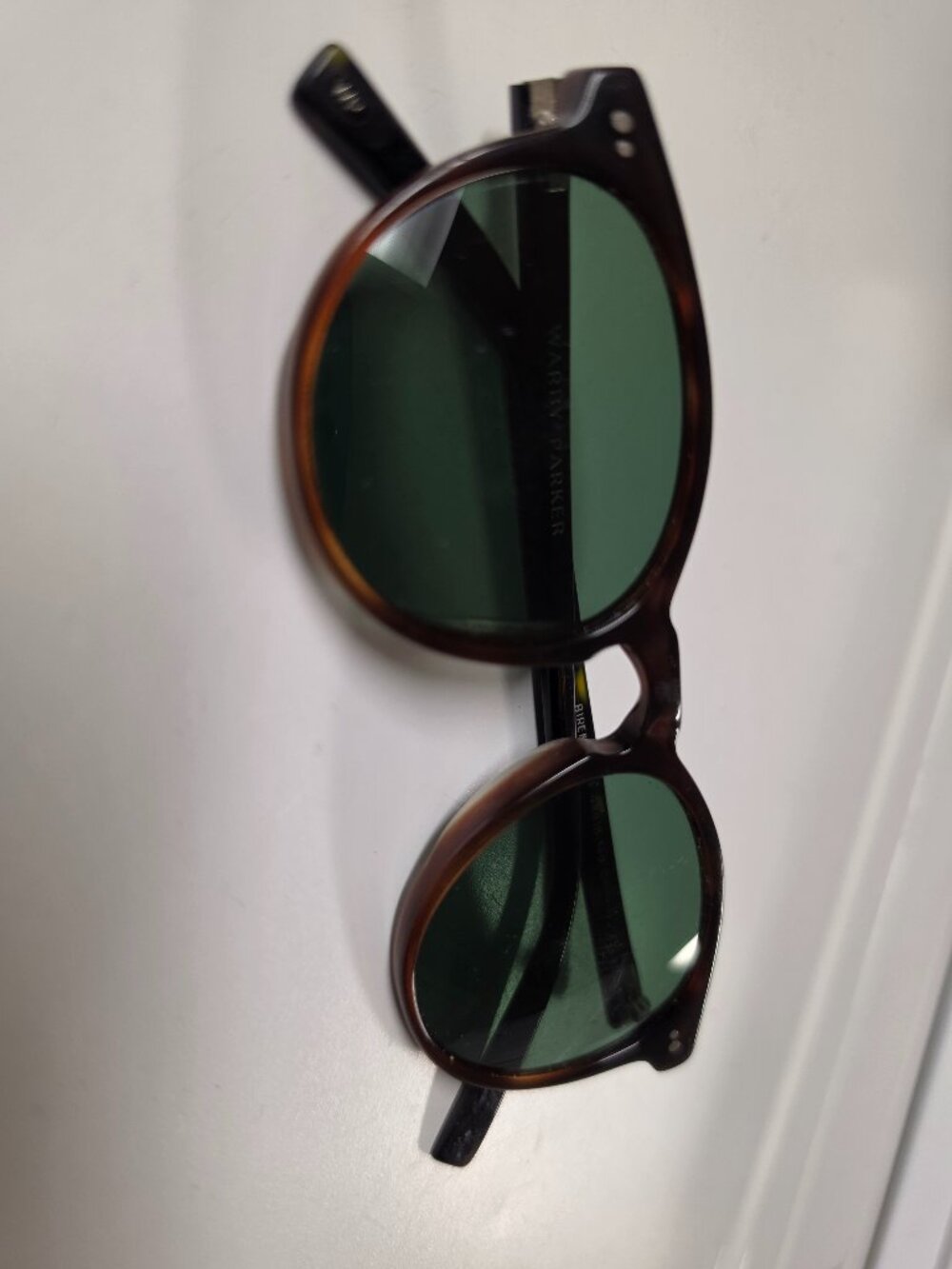 Warby Parker tortoise shell acetate sunglasses with green lenses